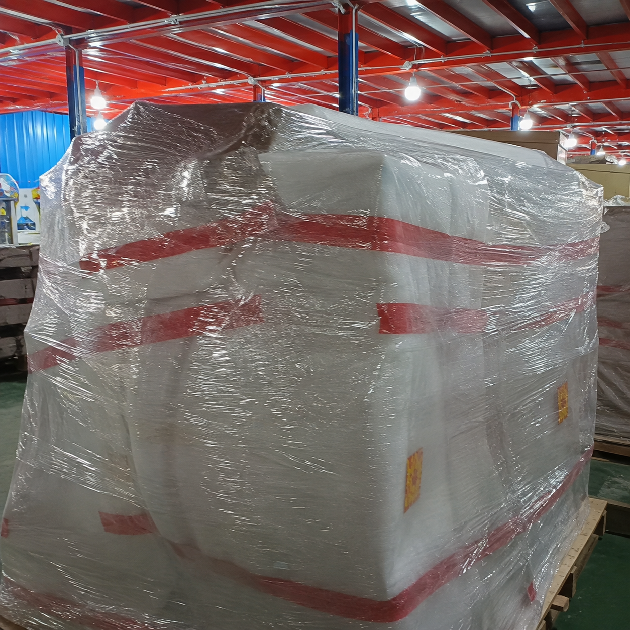 Commercial arcade machine protected with EPE foam and stretch film